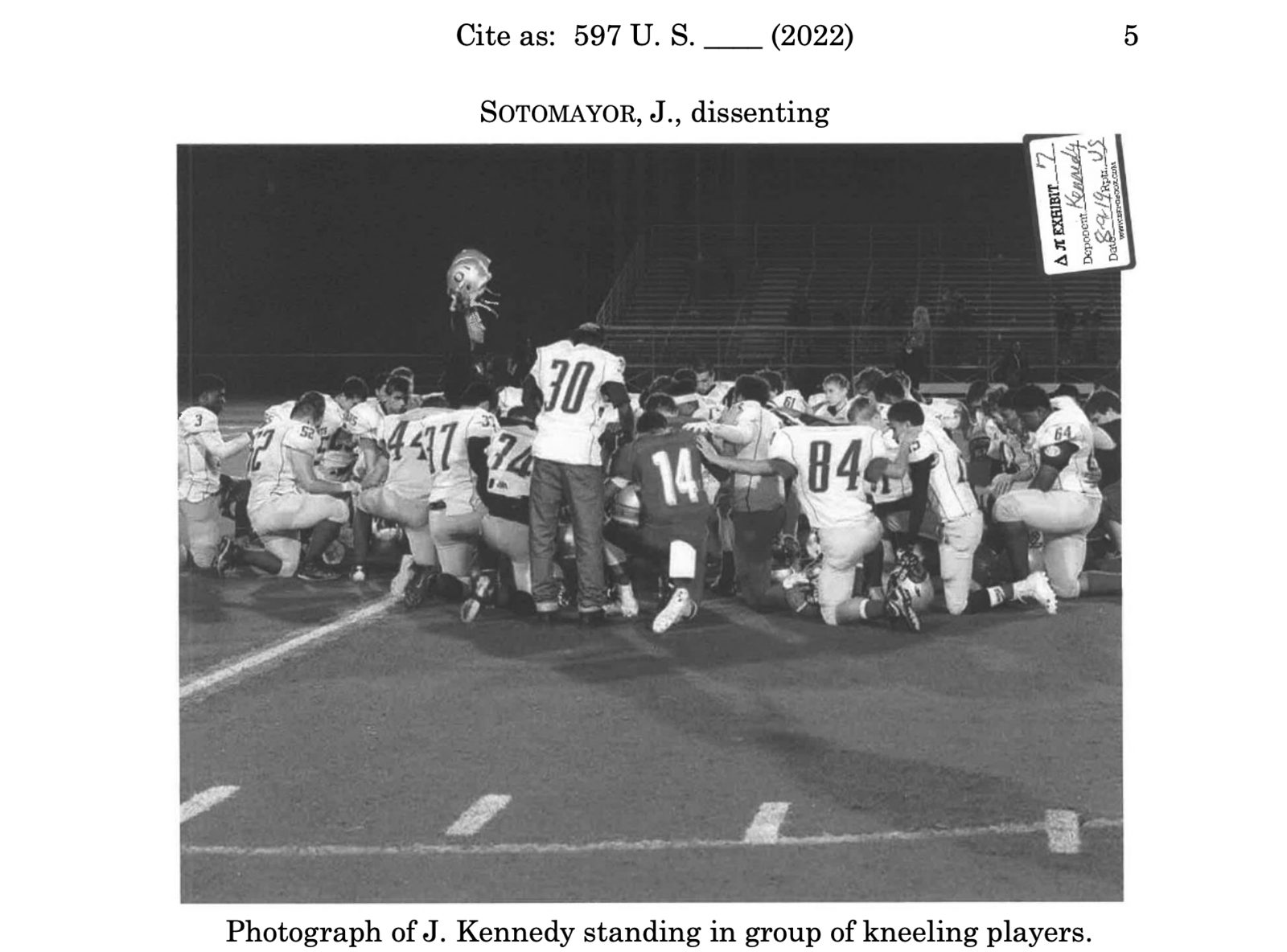 A photo of Joe Kennedy standing in a group of praying players was used as an exhibit in Supreme Court Justice Sonia Sotamayor's dissenting opinion.  Screenshot