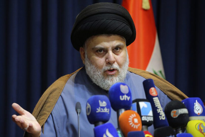 FILE - Populist Shiite cleric Muqtada al-Sadr, speaks during a mews conference in Najaf, Iraq, Nov. 18, 2021. Residents of the impoverished Baghdad suburb of Sadr City say they they support al-Sadr an influential Shiite cleric who called on thousands of his followers to storm Iraq's parliament. Al-Sadr derives his political weight largely from their seemingly unending support. And yet, they are among Iraq’s most destitute. (AP Photo/Anmar Khalil, File)