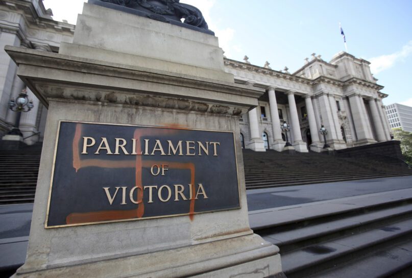 A Nazi swastika is seen graffitied on the front of the Victorian State Parliament in Melbourne, Australia, Monday, Oct. 1, 2012. New South Wales, the nation’s most populous state, on Thursday, Aug. 11, 2022, followed Victoria, the second-most populous, which banned the public display of Nazi swastikas in June. (David Crosling/AAP Image via AP)