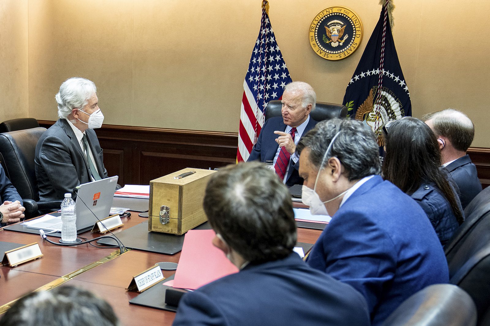 President Biden meets with his national security team on July 1, 2022, to discuss the drone strike that killed al-Qaida leader Ayman al-Zawahiri on July 31. The wooden box in front of the president contains a replica of the house where al-Zawahiri was living in Kabul, Afghanistan. (Official White House Photo by Adam Schultz/Public Domain)