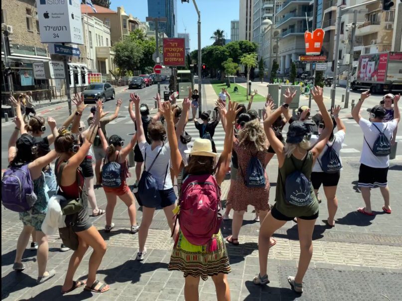 Participants on a recent Birthright Israel addiction recovery trip dance in the streets of Tel Aviv, Israel. Photo courtesy of Israel Free Spirit
