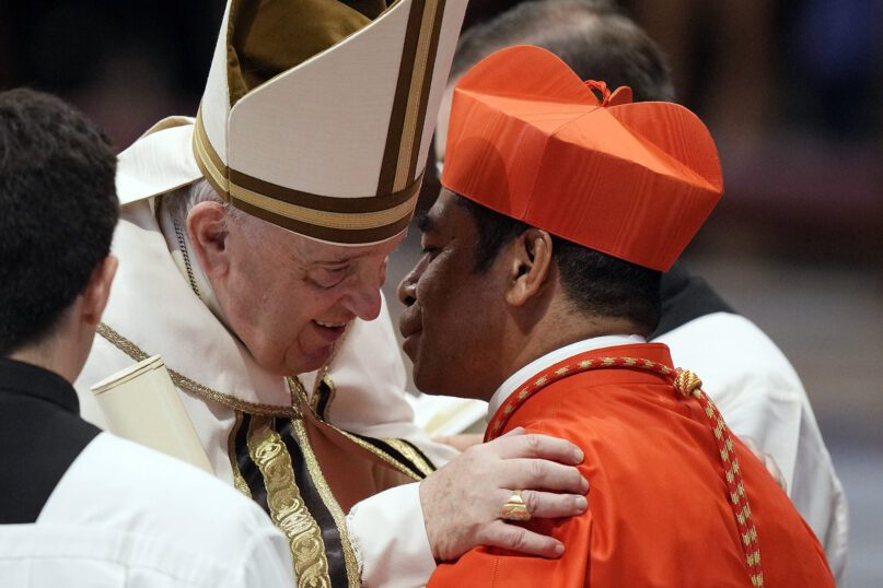 New Cardinal Virgilio Do Carmo Da Silva receives the red three-cornered biretta hat from Pope Francis during a consistory inside St. Peter’s Basilica, at the Vatican, Aug. 27, 2022. Francis has chosen 20 men to become the Catholic Church’s newest cardinals. (AP Photo/Andrew Medichini)