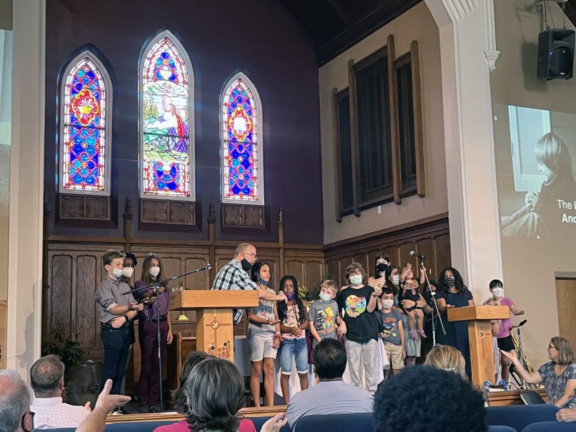 Congregational youth lead a blessing during the final service at Grace Evangelical Covenant Church on Aug. 28, 2022, in Chicago. RNS photo by Bob Smietana