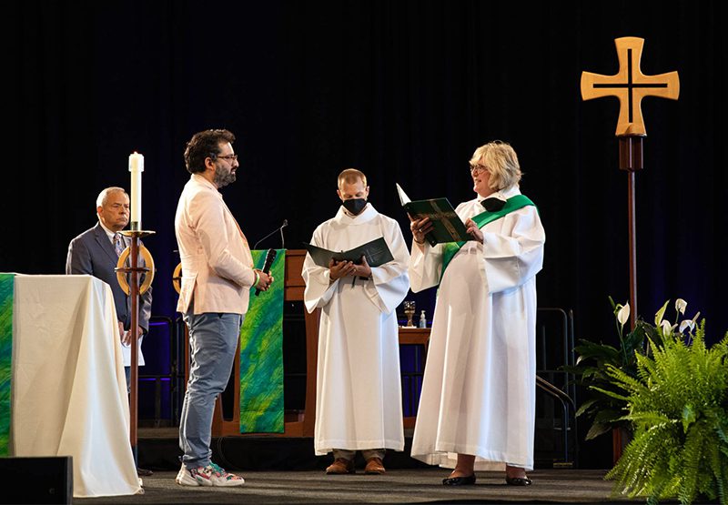 Imran Siddiqui, left, is installed as ELCA vice president during the closing worship service, which included a prayer led by Secretary Sue Rothmeyer, right, Aug. 12, 2022, in Columbus, Ohio. Photo by Rachel Kingsley/ELCA