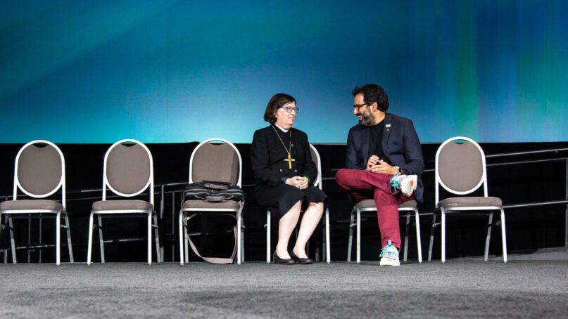 Presiding Bishop Elizabeth Eaton, left, and Imran Siddiqui converse during the ELCA Churchwide Assembly after Siddiqui's election as vice president of the ELCA on Thursday, Aug. 11, 2022, in Columbus, Ohio. Photo by Will Nunnally/ELCA