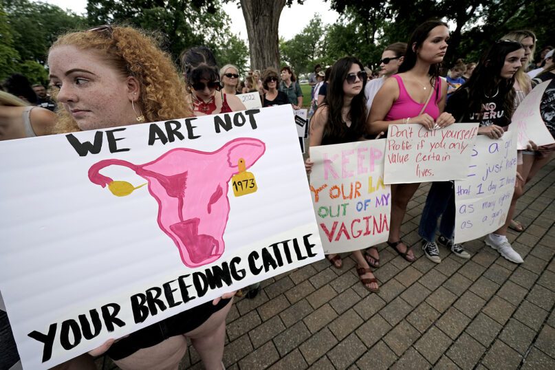 Abortion-rights advocates gather outside the Kansas Statehouse in Topeka to protest the Supreme Court’s ruling on abortion, June 24, 2022. (AP Photo/Charlie Riedel)