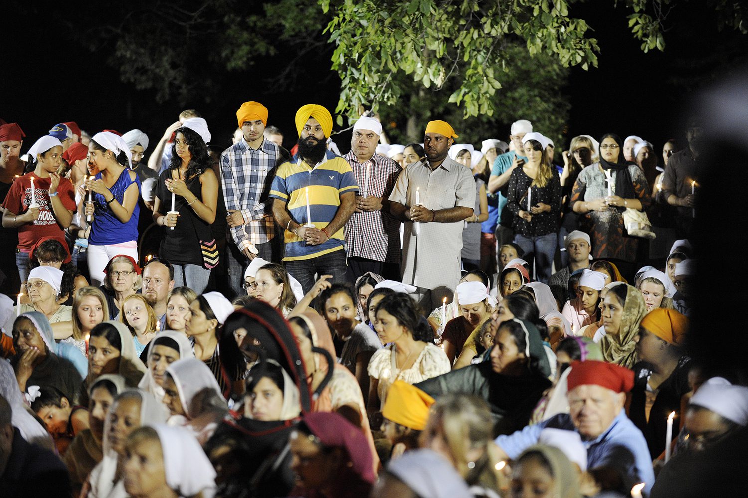 Community members joined the Sikhs by wearing head coverings during the vigil in Oak Creek on Tuesday, Aug. 7, 2012. Photo by Ernie Mastroianni photo, courtesy of Sikh Coalition