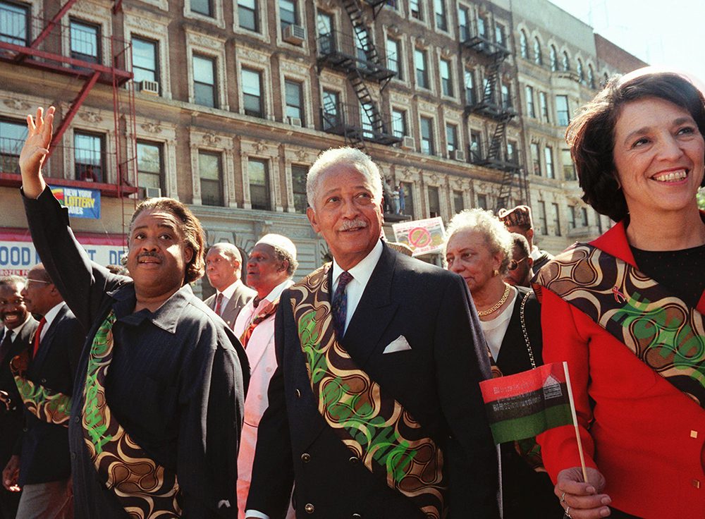 FILE - In this Sunday, Sept. 21, 1997, file photo, former New York Mayor David Dinkins, center, marches at the front of the 29th annual African-American Day Parade in Harlem flanked by Al Sharpton, left, and Ruth Messinger, in New York. (AP Photo/Michael Schmelling, File)