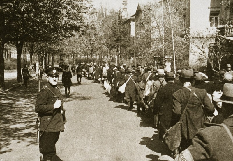 Jewish deportees march through the German town of Würzburg to the railroad station on April 25, 1942. (US Holocaust Memorial Museum, courtesy of National Archives and Records Administration)