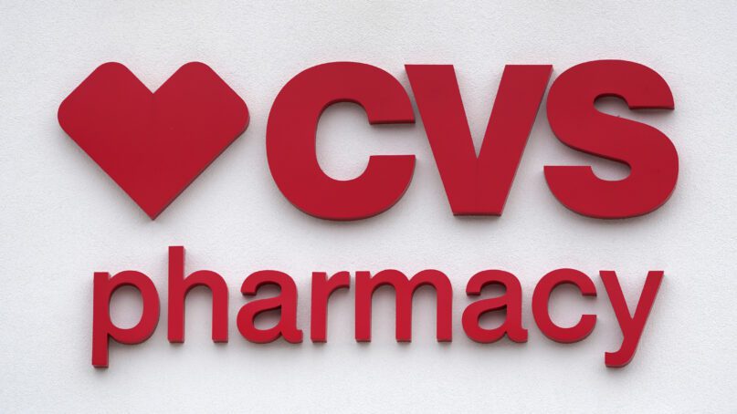 The CVS Pharmacy logo is displayed on a store on Aug. 3, 2021, in Woburn, Mass. (AP Photo/Charles Krupa)