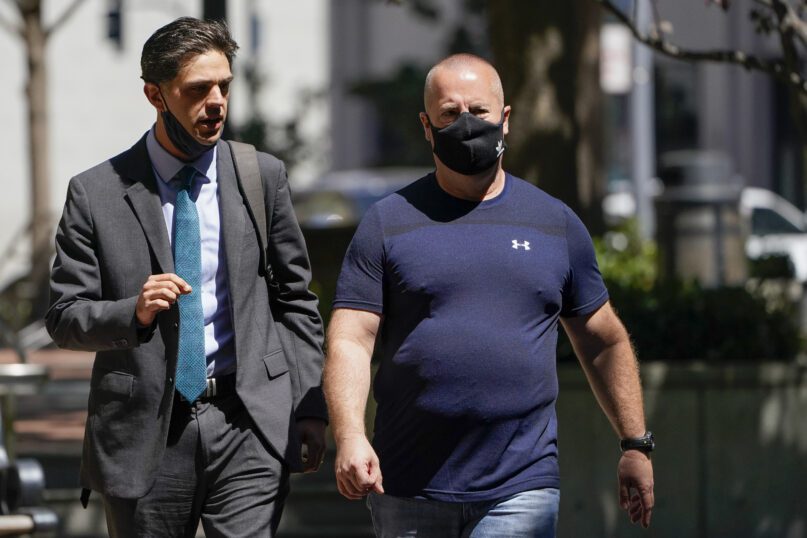 James Theodore Highhouse, right, arrives for his sentencing hearing at U.S. District Court with his attorney Jaime Dorenbaum, left, in Oakland, Calif., Wednesday, Aug. 31, 2022. Highhouse pleaded guilty to sexually abusing an inmate while working as a prison chaplain at a federal women's prison in Dublin, Calif. (AP Photo/Godofredo A. Vásquez)
