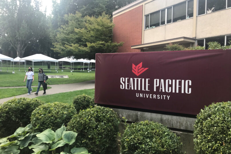 Students walk on the campus of Seattle Pacific University in Seattle on Sept. 11, 2022. (AP Photo/Chris Grygiel)