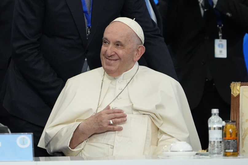 Pope Francis smiles before delivering a final declaration of the seventh Congress of Leaders of World and Traditional Religions, at the Palace of Peace and Reconciliation, in Nur-Sultan, Kazakhstan, Sept. 15, 2022. (AP Photo/Alexander Zemlianichenko)