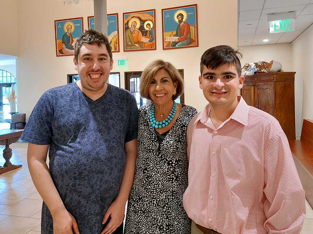 Anthony Giangiobbe, from left, Melina Angelson and Dimitri Donus pose together at Dormition of the Virgin Mary Greek Orthodox Church of the Hamptons in Southampton, New York, on Sept. 11, 2022. RNS photo by Adelle M. Banks