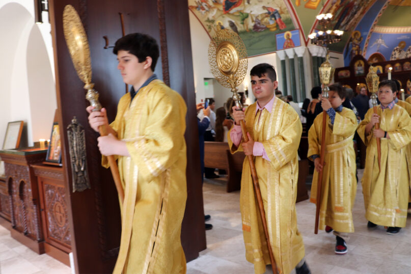 Dimitri Donus, second from left, processes as an altar server during a service at Dormition of the Virgin Mary Greek Orthodox Church of the Hamptons in Southampton, New York, on Sept. 11, 2022. RNS photo by Adelle M. Banks
