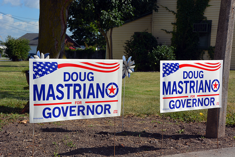 Campaign signs for Doug Mastriano in yard in Gettysburg, Pennsylvania. RNS photo by Jack Jenkins