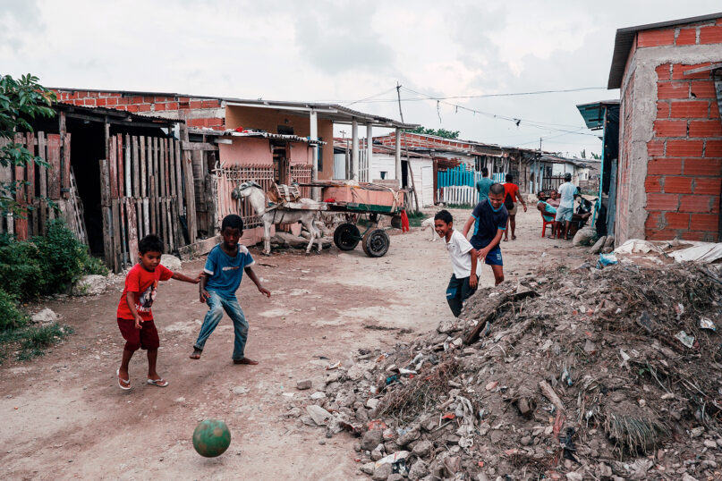 Children play in the streets of the Isla de León neighborhood in Cartagena, Colombia, in May 2022. Photo by Noel Rojo