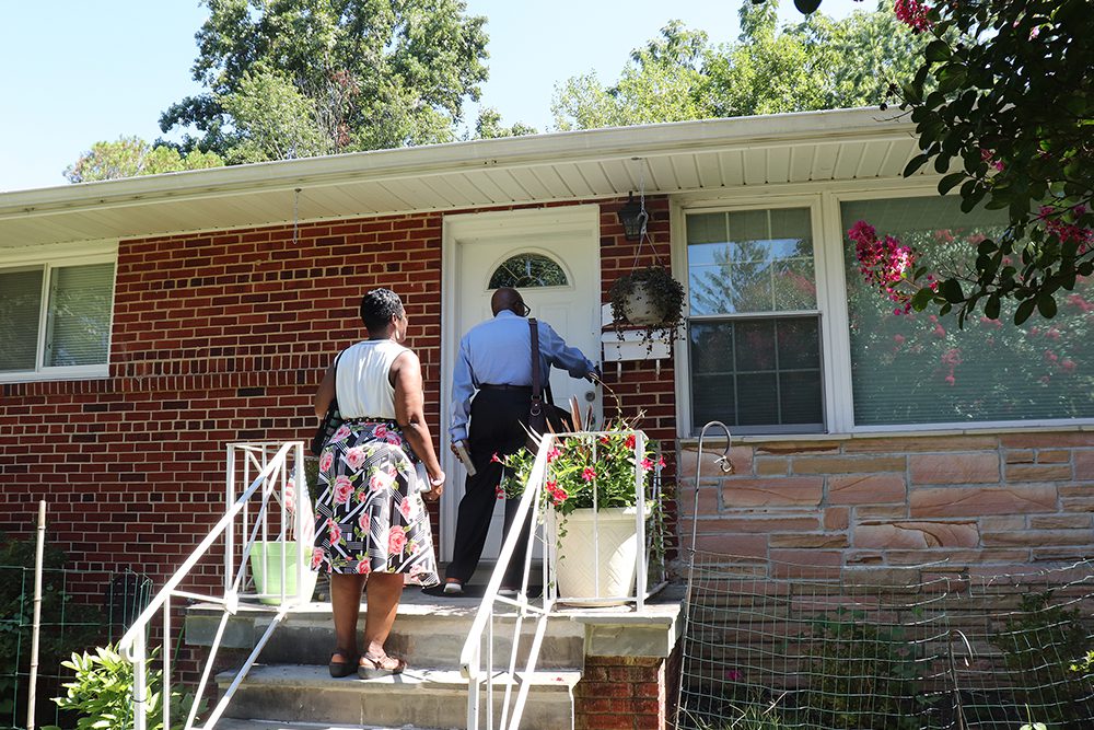Reneé and Kevin White were among Jehovah’s Witnesses returning to the traditional practice of door knocking in Silver Spring, Maryland, on Thursday, Sept. 1, 2022. RNS photo by Adelle M. Banks