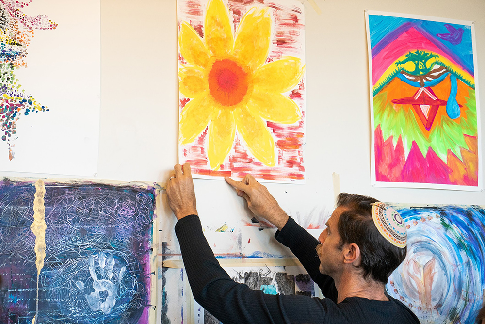 An artist hangs a piece at the Jewish Studio Project in Berkeley, California. Photo courtesy of JSP