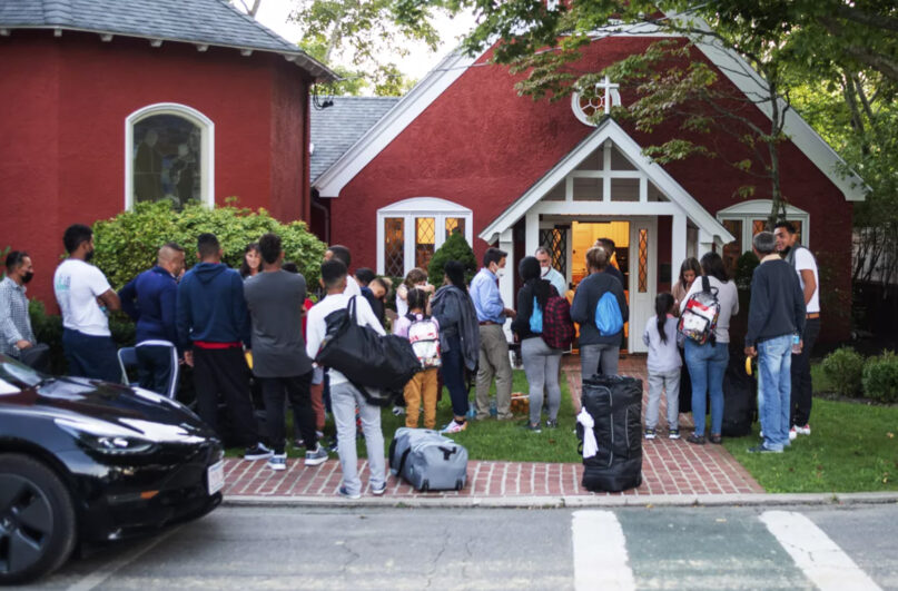 Immigrants gather with their belongings outside St. Andrew’s Episcopal Church, Sept. 14, 2022, in Edgartown, Massachusetts, on Martha’s Vineyard. Florida Gov. Ron DeSantis on Sept. 14 flew two planes of immigrants to Martha’s Vineyard, escalating a tactic by Republican governors to draw attention to what they consider to be the Biden administration’s failed border policies. (Ray Ewing/Vineyard Gazette via AP)