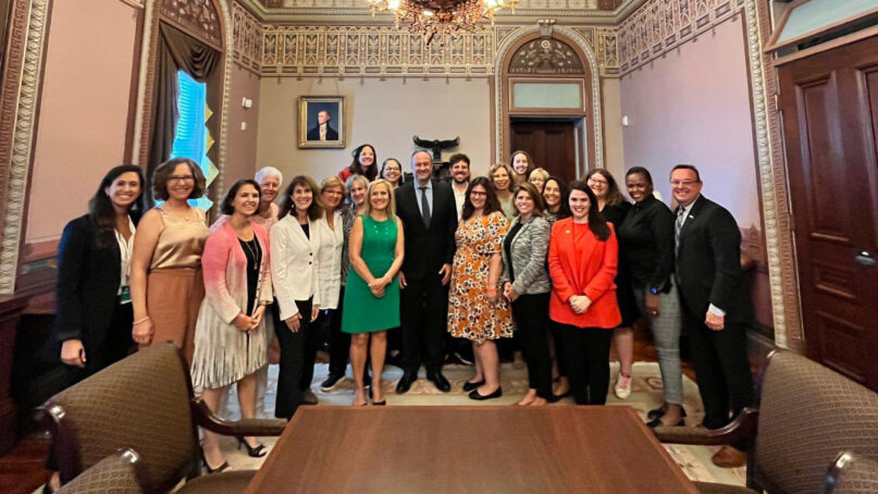 Second gentleman Douglas Emhoff, center, poses with representatives from the National Council of Jewish Women on Sept. 12, 2022, at the White House. Photo via Twitter/@NCJW