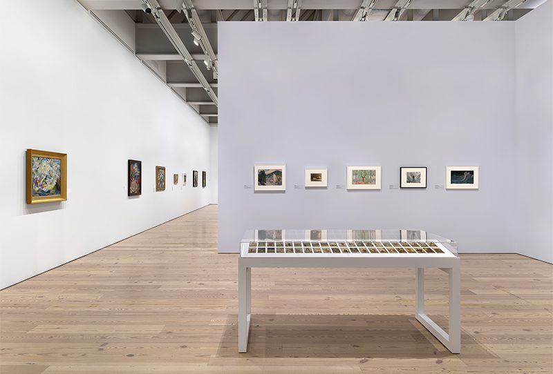 Installation view of At the Dawn of a New Age: Early Twentieth-Century American Modernism at the Whitney Museum of American Art in New York. The Rider-Waite-Smith Tarot Deck by Pamela Colman Smith is in the foreground. Photograph by Ron Amstutz/Whitney Museum of American Art