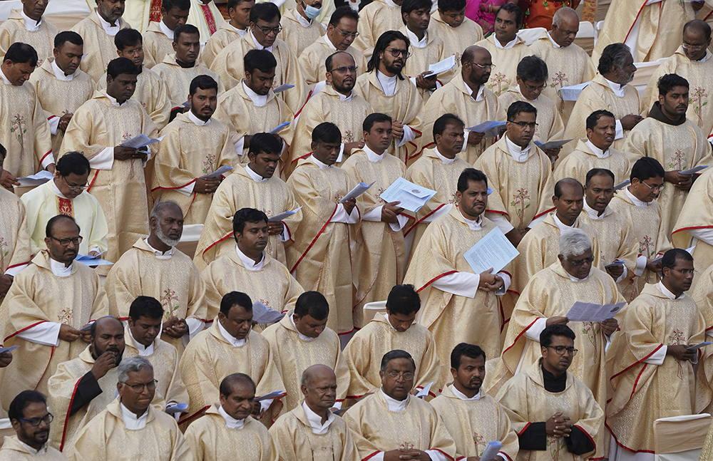 Catholic priests participate in a thanksgiving Mass for the elevation of Archbishop of Hyderabad Anthony Poola to cardinal, at St. Mary's high school in Hyderabad, India, Thursday, Sept. 15, 2022. Archbishop Poola is the first member of the Dalit community, considered the lowest rung of India's caste system, to become a cardinal. ( AP Photo/Mahesh Kumar A.)