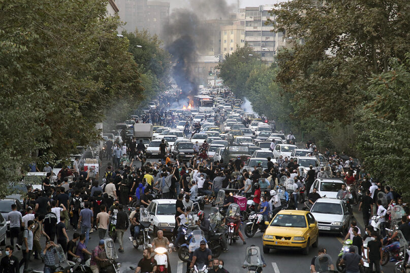 In this Wednesday, Sept. 21, 2022, photo taken by an individual not employed by the Associated Press and obtained by the AP outside Iran, protesters chant slogans during a protest over the death of a woman who was detained by the morality police, in downtown Tehran, Iran. (AP Photo)