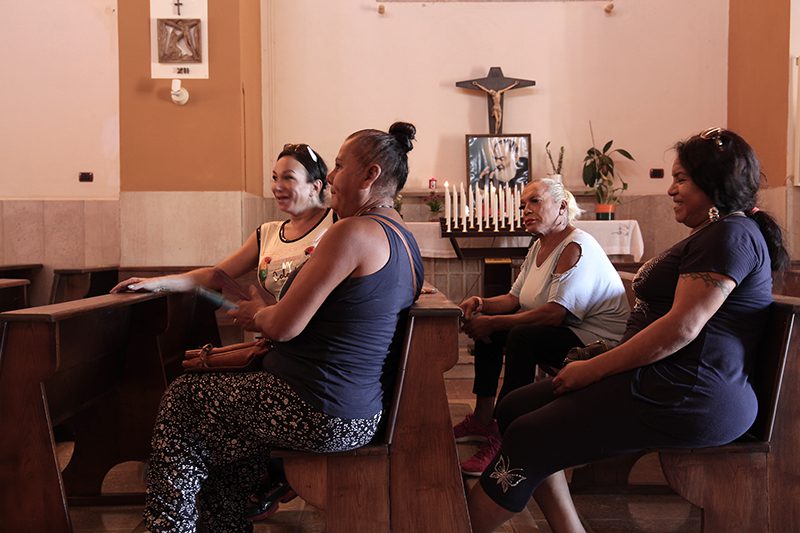 Marcella Demarco Muniz, from left, Claudia Salas, Laura and Minerva Motta Nuñes meet at the Church of the Immaculate Blessed Virgin on Monday, Sept. 5, 2022, in Torvaianica, Italy. RNS photo by Federico Manzoni
