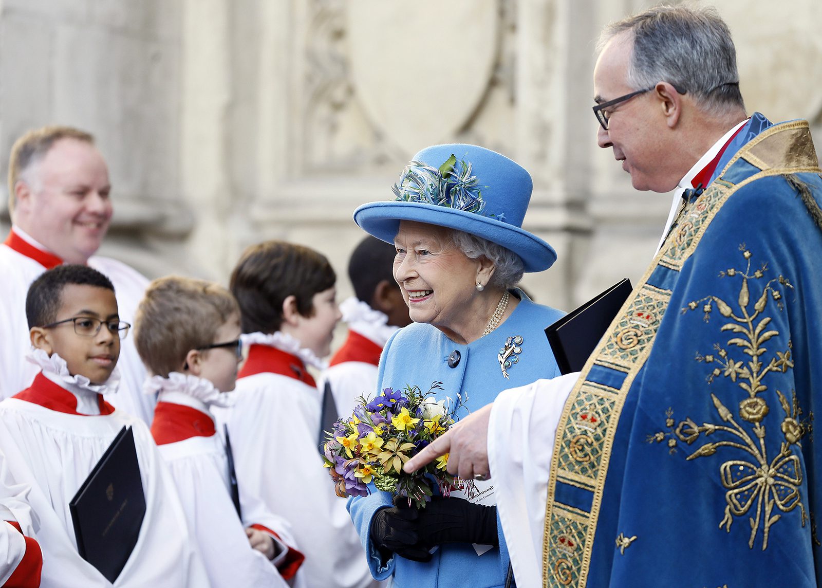 Britain's Queen Elizabeth II passes the choir as she leaves after attending the Commonwealth Day service at Westminster Abbey in London, Monday, March 14, 2016. Organised by the Royal Commonwealth Society, the service is the largest annual inter-faith gathering in the United Kingdom. (AP Photo/Kirsty Wigglesworth)