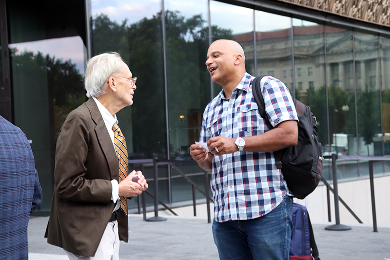 Bishop Derek Grier, right, founder of Let’s Talk,talks with missionary Doug Gentile outside the National Museum of African American History and Culture, Tuesday, Sept. 13, 2022, in Washington. RNS photo by Adelle M. Banks