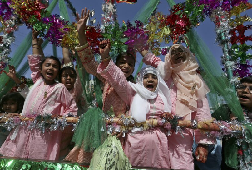 Girls chant religious slogans while celebrating Mawlid al-Nabi in Karachi, Pakistan in 2021.  (AP Photo/Fareed Khan)