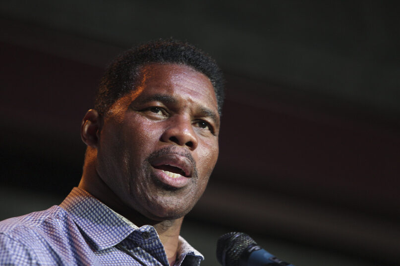 FILE - Herschel Walker, GOP candidate for the US Senate for Georgia, speaks at a primary watch party on May 23, 2022, at the Foundry restaurant in Athens, Ga. According to a new report published late Monday, Oct. 3, Walker, who has vehemently opposed abortion rights as the Republican nominee for U.S. Senate in Georgia, paid for an abortion for his girlfriend in 2009. The candidate called the accusation a “flat-out lie” and threatened to sue. (AP Photo/Akili-Casundria Ramsess, File)