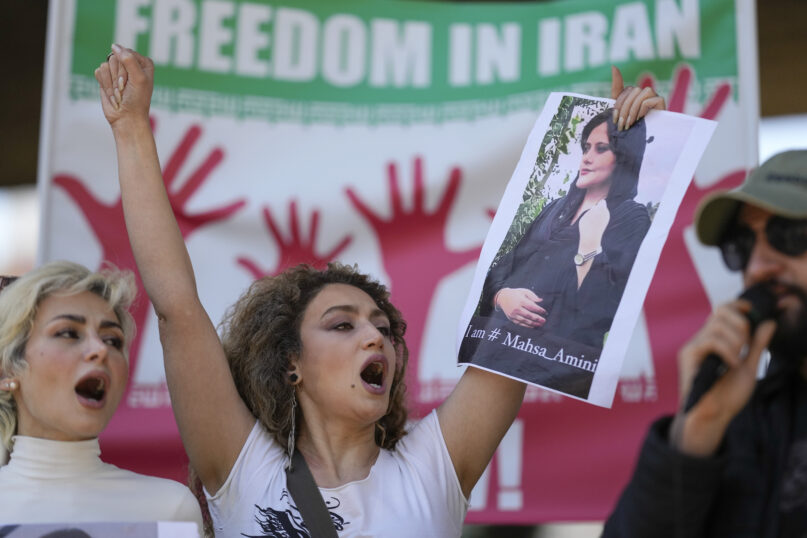 FILE - Iranians who live in Brazil protest against the death of Iranian woman Mahsa Amini, who died in Iran while in police custody, in Sao Paulo, Brazil, Friday, Sept. 23, 2022. As anti-government protests roil cities and towns in Iran for a fourth week, sparked by the death of a 22-year-old woman detained by Iran's morality police, tens of thousands of Iranians living abroad have marched on the streets of Europe, North America and beyond in support of what many believe to be a watershed moment for their home country. (AP Photo/Andre Penner, File)