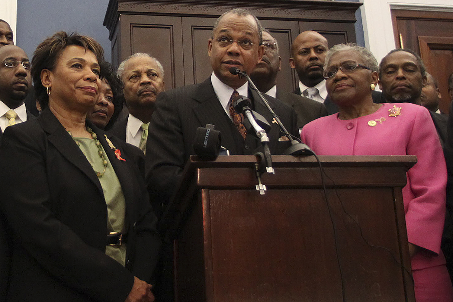 FILE - Rep. Barbara Lee, D-Calif., Rev. Calvin Butts, and Rep. Alcee Hastings, D-Fla., are joined at podium by other church and community leaders from New York, on Capitol Hill in Washington, Wednesday, March 17, 2010. Butts, who welcomed generations of worshippers as well as politicial leaders from across the nation and around the world at Harlem's landmark Abyssinian Baptist Church, died Friday, Oct. 28, 2022 at age 73, the church announced. (AP Photo/Lauren Victoria Burke, File)