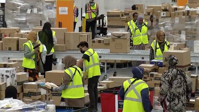 Employees work recently at an Amazon facility in Woodbury, Minnesota. Video screen grab via KSTP