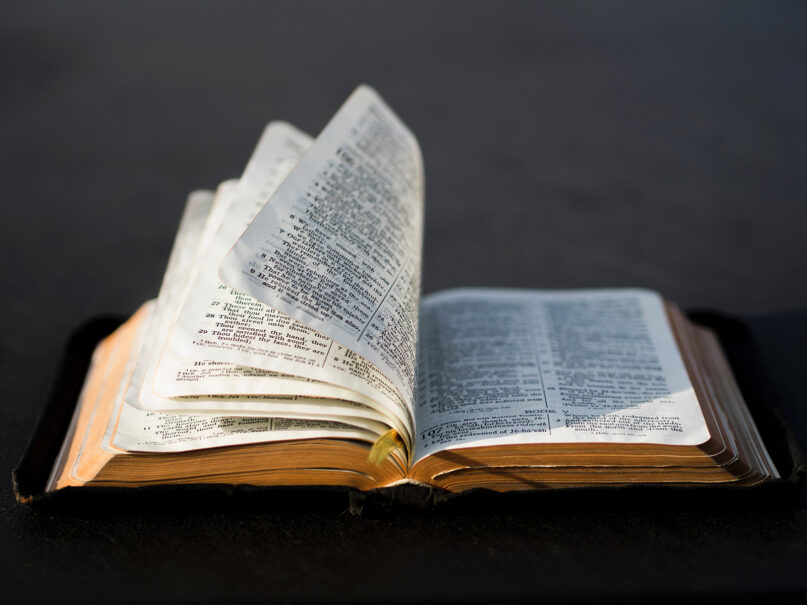 Pages are blown in an open Bible. Photo by Aaron Burden/Unsplash/Creative Commons