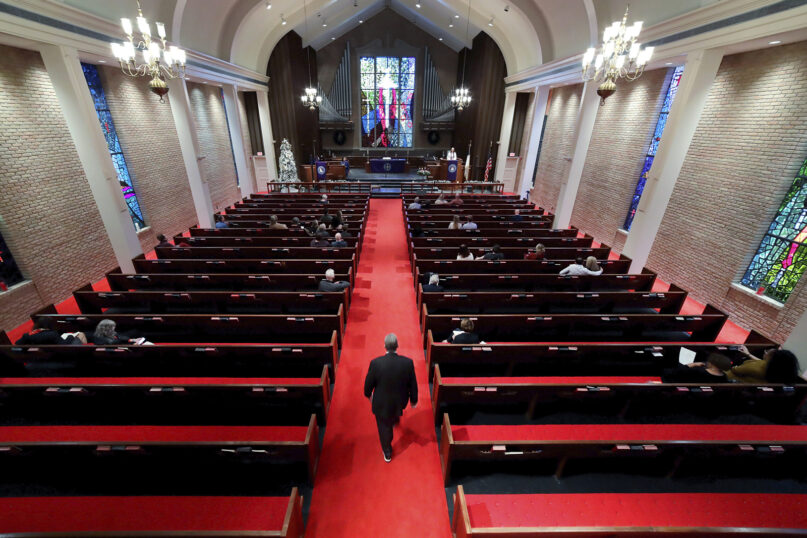 Congregants listen to a sermon at Westminster United Methodist Church,  Dec. 12, 2021, in Houston. (AP Photo/Michael Wyke)