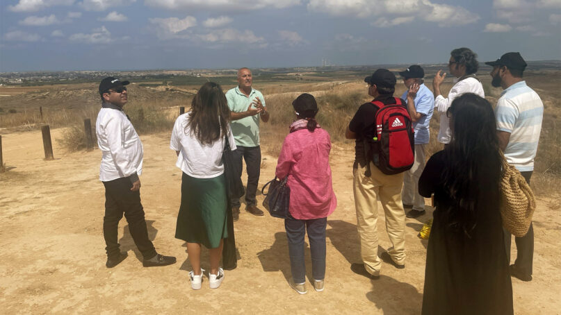 Retired Israel Defense Forces Col. Grisha Yakubovich speaks to a Pakistani delegation at the Gaza border in late September 2022, in Israel. Photo by BeLynn Hollers