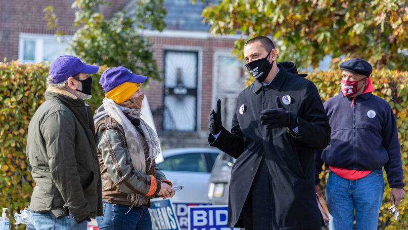 The Rev. Adam Russell Taylor, center right, works as a poll chaplain during election day on Nov. 3, 2020, in Philadelphia. Photo by Danielle Hall/Sojourners