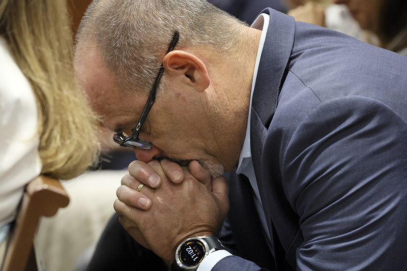Fred Guttenberg reacts as he awaits a verdict in the death penalty trial of Marjory Stoneman Douglas High School shooter Nikolas Cruz at the Broward County Courthouse in Fort Lauderdale, Fla., on Thursday, Oct. 13, 2022. Guttenberg's daughter, Jaime, was killed in the 2018 shootings. Cruz, who plead guilty to 17 counts of premeditated murder in the 2018 shootings, is the most lethal mass shooter to stand trial in the U.S. He was previously sentenced to 17 consecutive life sentences without the possibility of parole for 17 additional counts of attempted murder for the students he injured that day. (Amy Beth Bennett/South Florida Sun-Sentinel via AP, Pool)