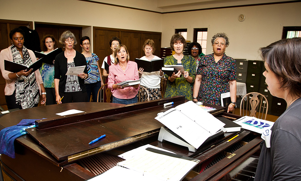 Susan DeSelms, right, leads a United Parish choir rehearsal in Brookline, Mass. Photo courtesy of DeSelms