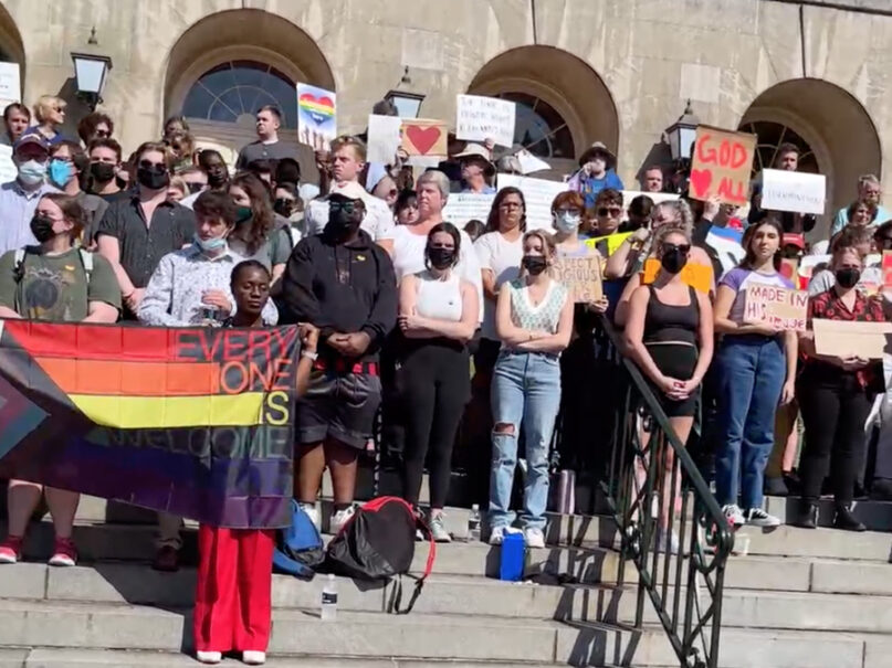 Dozens of people participate in a silent protest against Samford University's LGBTQ policies, outside of an event being held by Samford’s Office of Spiritual Life, Sept. 20, 2022, at Samford University in Birmingham, Alabama. Video screen grab courtesy of Brit Blalock