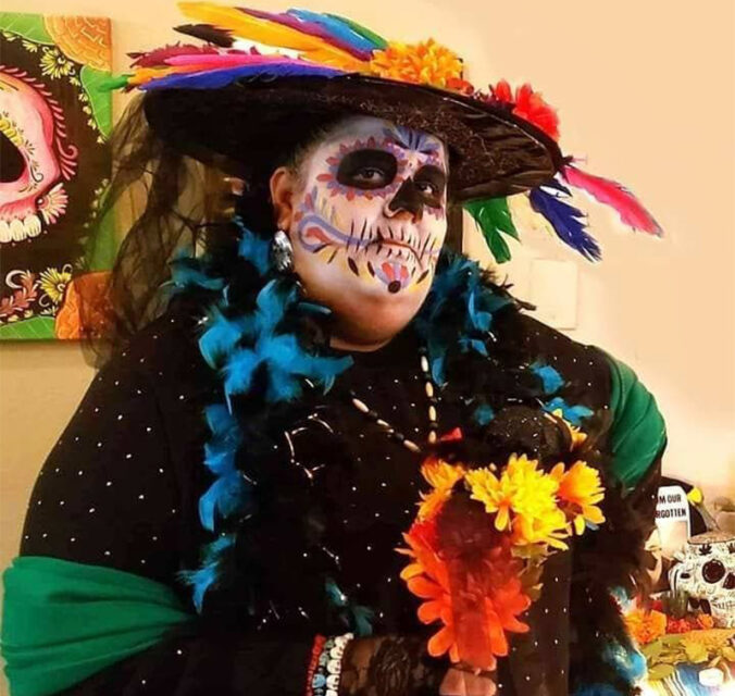 The Rev. Laura Gonzalez poses after teaching about Day of the Dead at a bookstore in Chicago in 2019. Courtesy photo