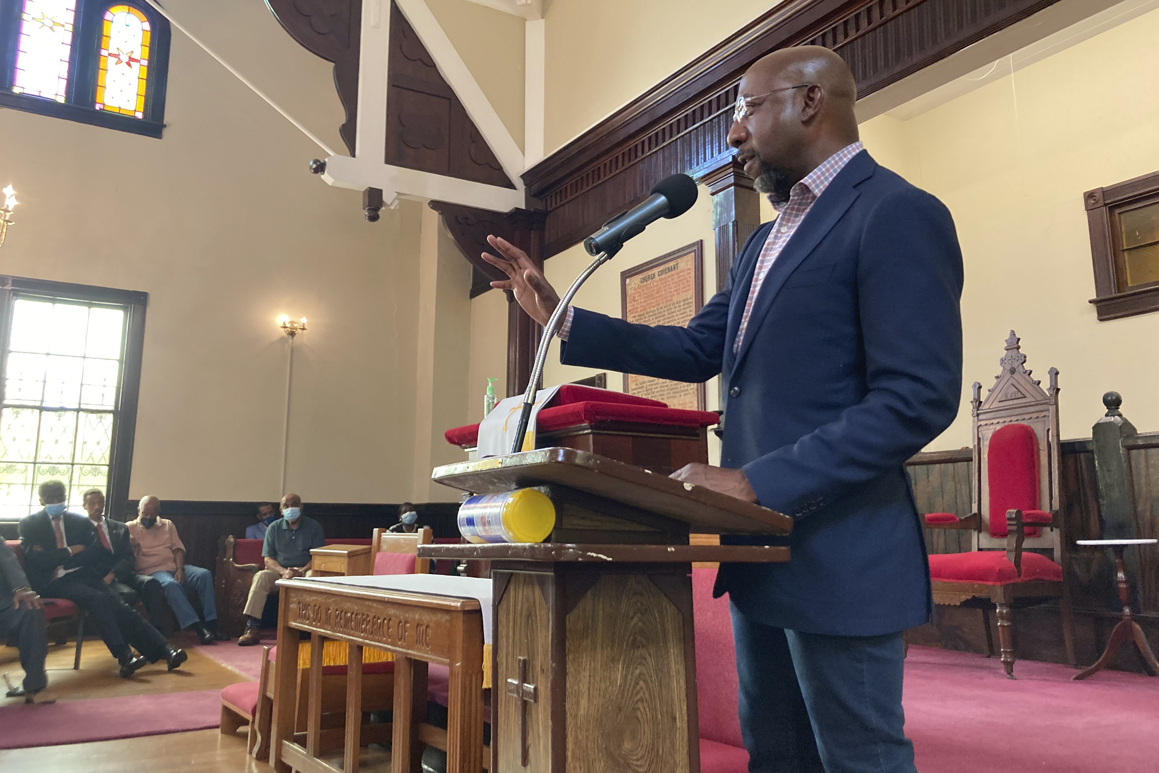 FILE - Sen. Raphael Warnock, D-Ga., who is the pastor of Ebenezer Baptist Church in Atlanta, campaigns at a church by the same name in Eatonton, Ga., on Aug. 18, 2022. (AP Photo/Bill Barrow)