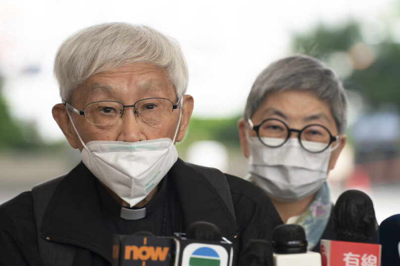Cardinal Joseph Zen, left, speaks to members of the media at the West Kowloon Magistrates's Courts after the verdict session in Hong Kong, Friday Nov. 25, 2022. The 90-year-old Catholic cardinal and five others in Hong Kong were fined after being found guilty Friday of failing to register a now-defunct fund that aimed to help people arrested in the widespread protests three years ago. (AP Photo/Anthony Kwan)
