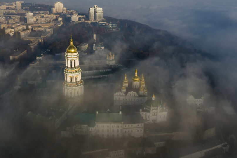 An aerial photo shows the thousand-year-old Monastery of Caves, also known as Kiev Pechersk Lavra, the holiest site of Eastern Orthodox Christians, taken through morning fog during a sunrise in Kyiv, Ukraine, Nov. 10, 2018. (AP Photo/Evgeniy Maloletka, File)