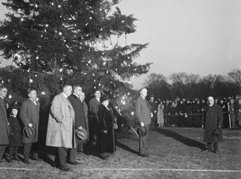 President Calvin Coolidge, center right, participates in the first National Christmas Tree lighting ceremony on the Ellipse on Dec. 24, 1923. Photo courtesy of LOC/Creative Commons