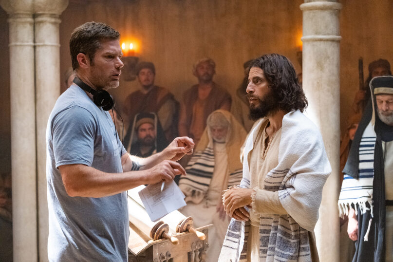 Director Dallas Jenkins, left, and actor Jonathan Roumie, portraying Jesus, discuss a synagogue scene for season three on the set of “The Chosen.