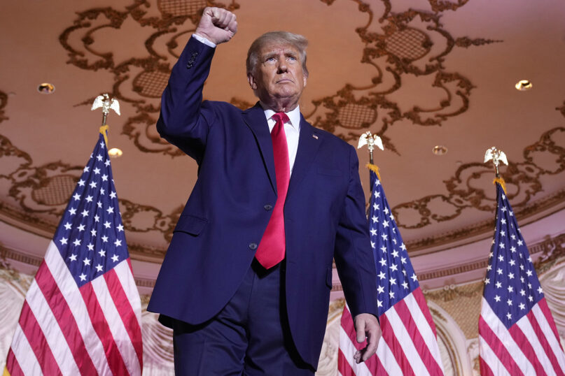 Former President Donald Trump gestures after announcing he is running for president for the third time as he speaks at Mar-a-Lago in Palm Beach, Florida, Nov. 15, 2022. (AP Photo/Andrew Harnik)